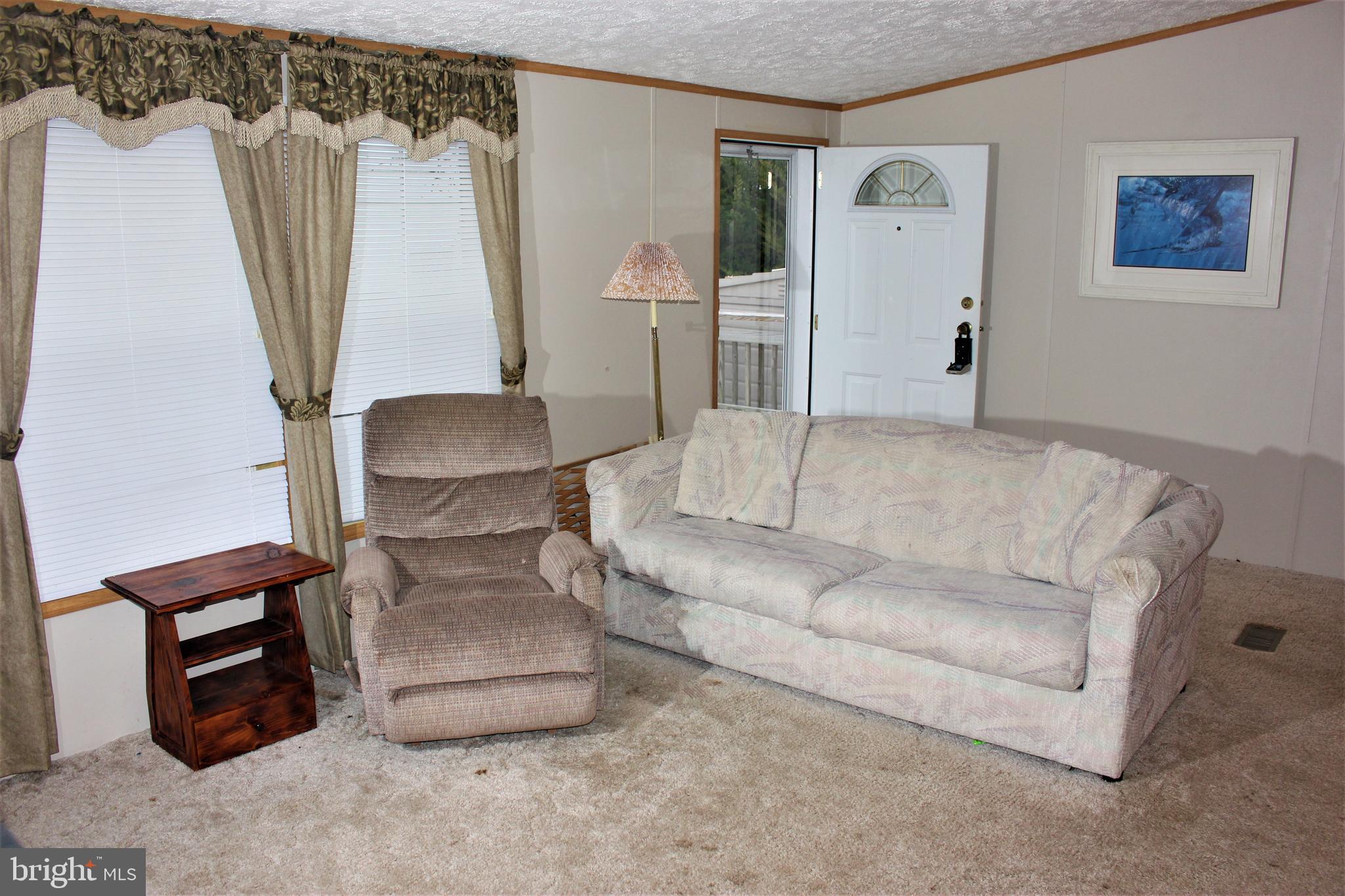 28288 Basin Road Millsboro, DE 19966 - Photo 10 of 38 Large living room comes furnished.