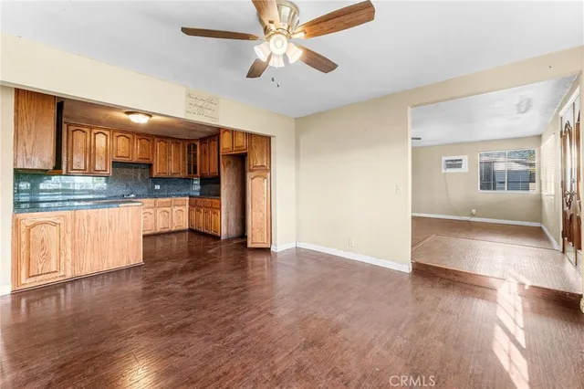 a view of a kitchen with a stove cabinets and wooden floor