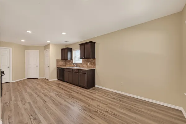 a view of kitchen with wooden floor
