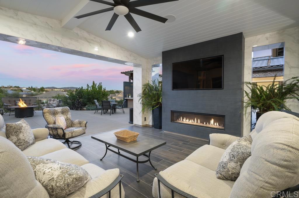 15433 Artesian Ridge San Diego, CA 92127 - Photo 15 of 20 a living room with furniture and a fireplace