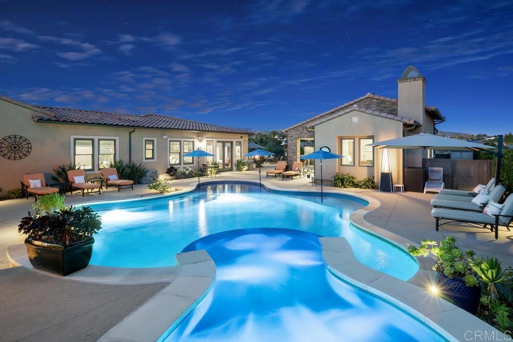 15433 Artesian Ridge San Diego, CA 92127 - Photo 18 of 20 a living room with furniture a swimming pool and a potted plants