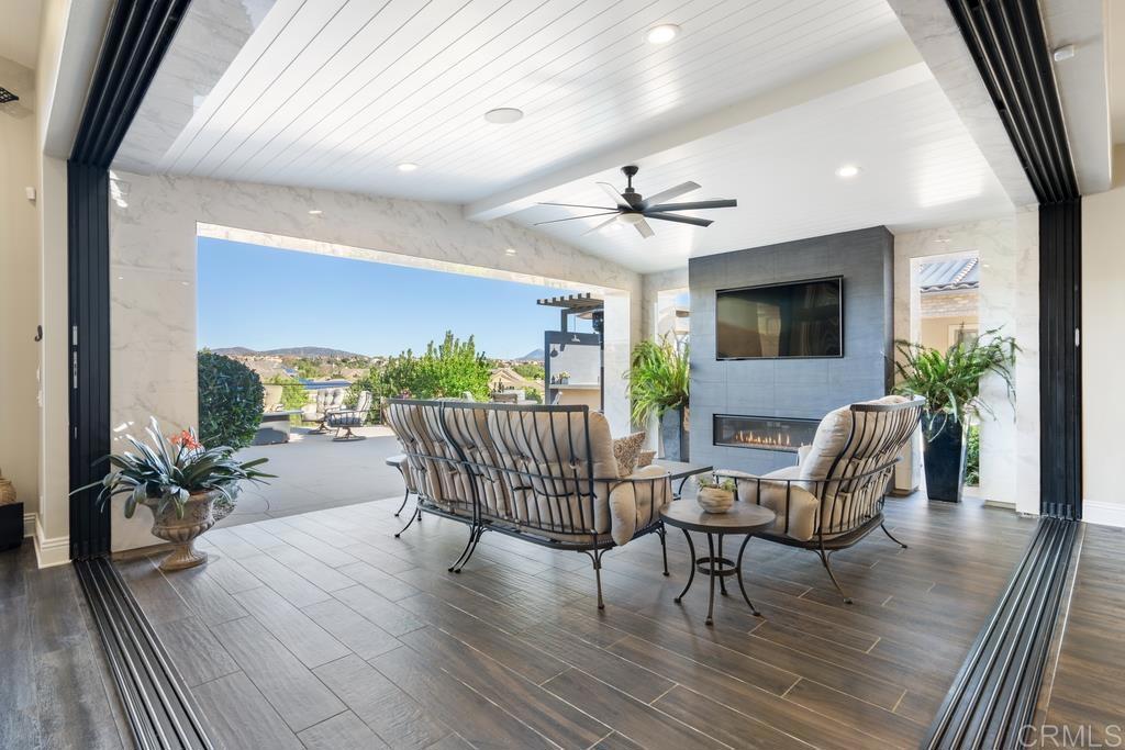 15433 Artesian Ridge San Diego, CA 92127 - Photo 5 of 20 a view of a livingroom with furniture and a floor to ceiling window