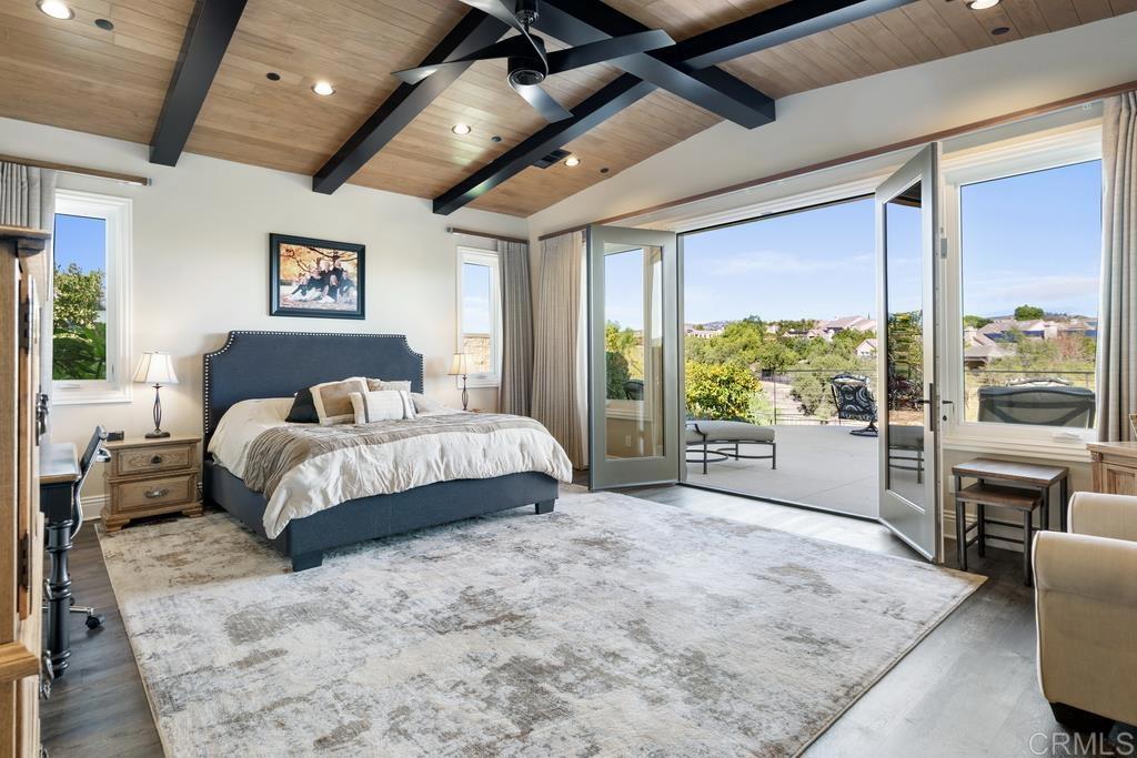15433 Artesian Ridge San Diego, CA 92127 - Photo 7 of 20 a spacious bedroom with a large bed and a large window