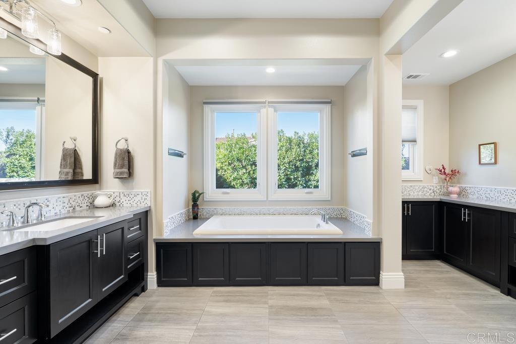 15433 Artesian Ridge San Diego, CA 92127 - Photo 8 of 20 a bathroom with a large tub shower and sink