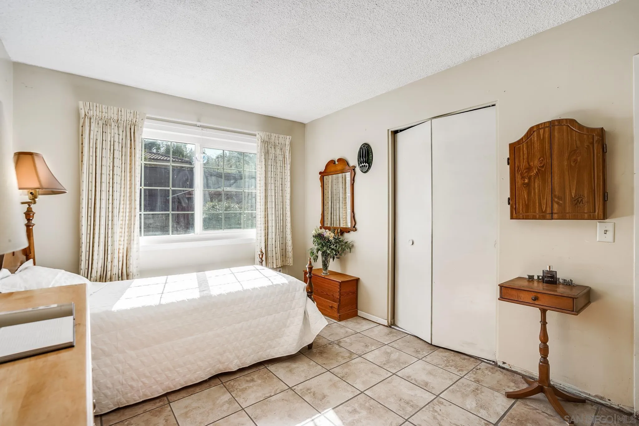 1520 Ransom Place Riverside, CA 92506 - Photo 18 of 33 a bedroom with a bed and a window