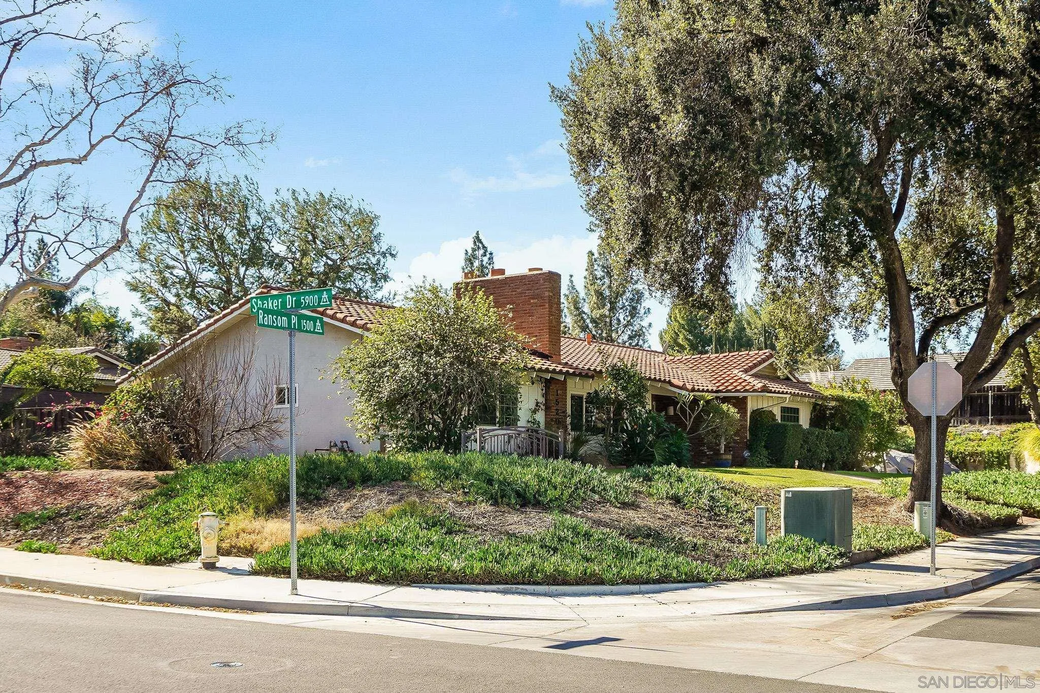 1520 Ransom Place Riverside, CA 92506 - Photo 3 of 33 a view of a house with a yard and large trees