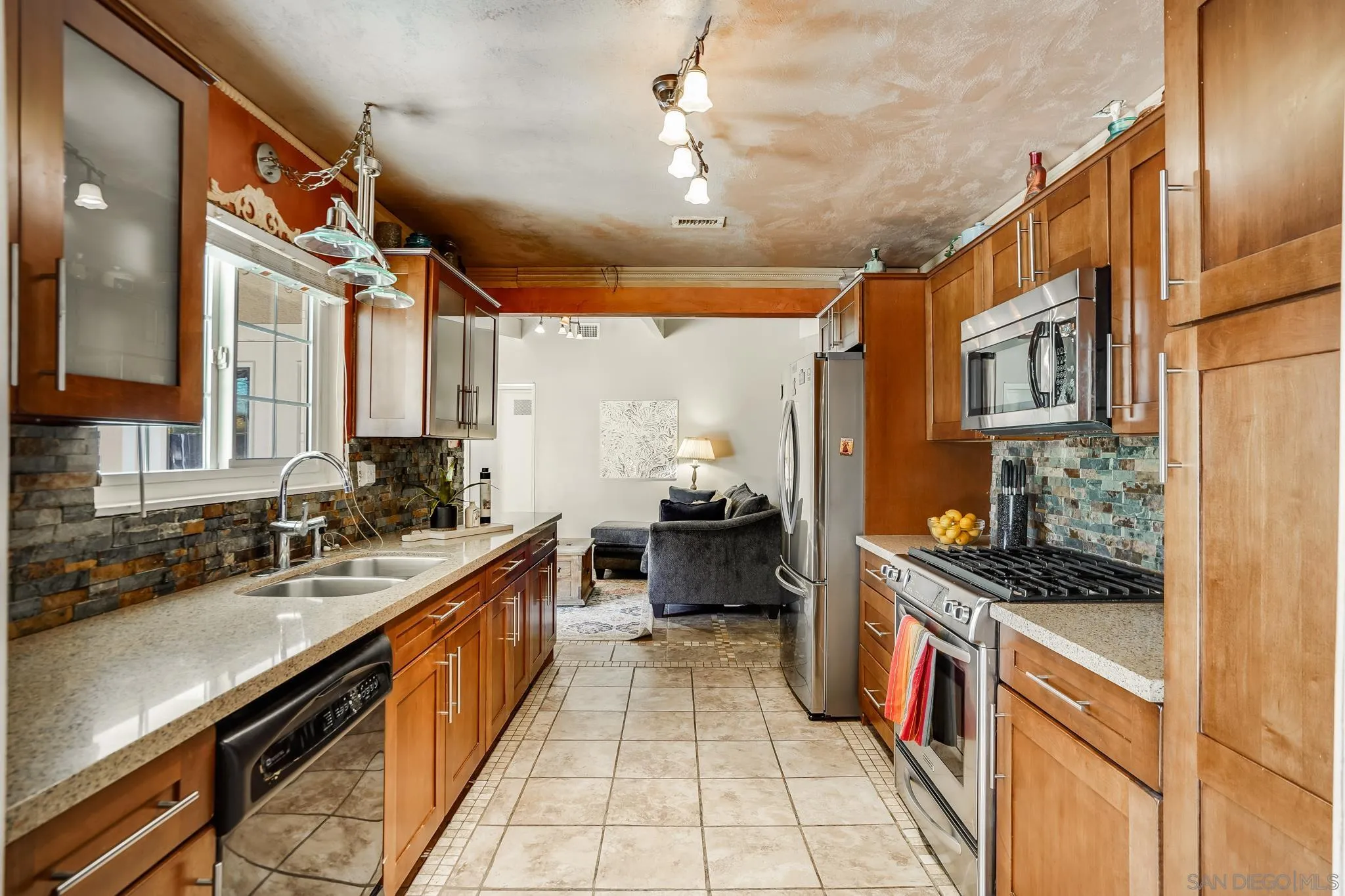1520 Ransom Place Riverside, CA 92506 - Photo 10 of 33 a kitchen with stainless steel appliances a sink stove and cabinets