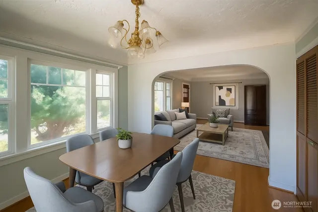 a view of a dining room with furniture window and outside view