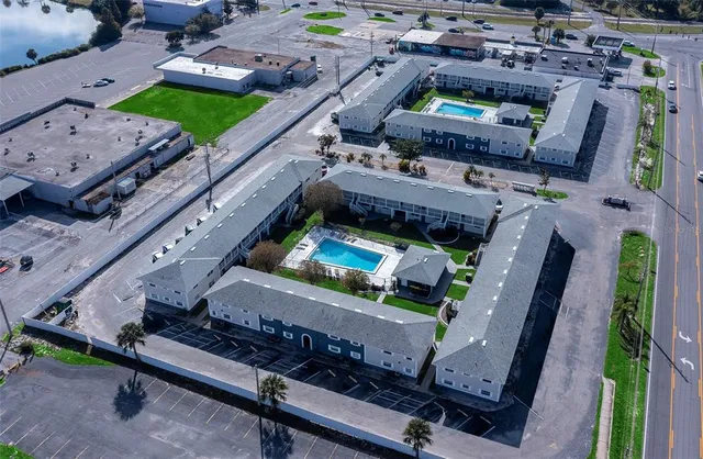 an aerial view of a balcony with chairs