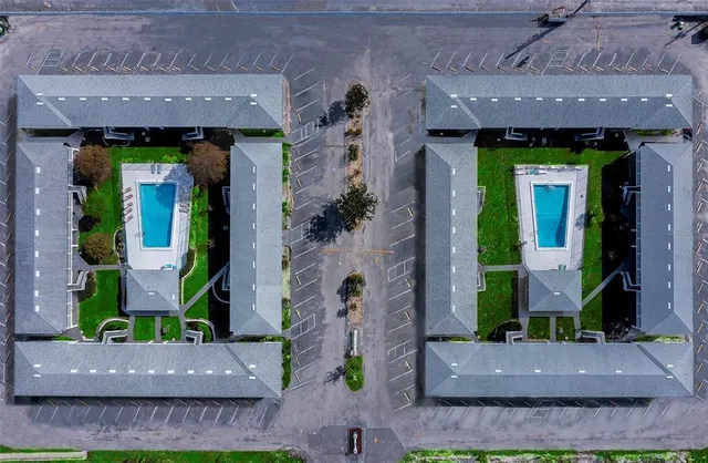 an aerial view of a house with potted plants