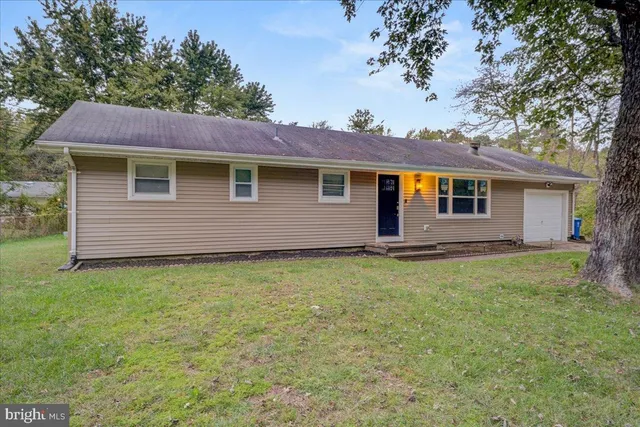 a backyard of a house with seating space