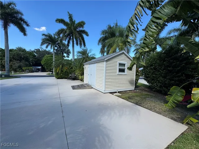 a view of a house with a yard and plant