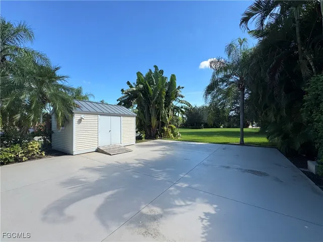 a view of a house with a yard and garage