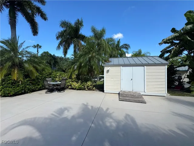 a view of a house with a yard and garage