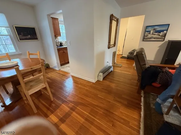 a view of workspace with wooden floor windows