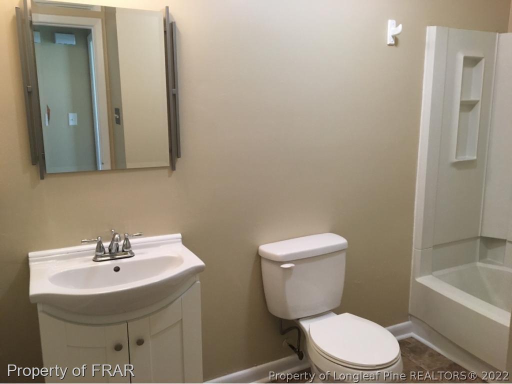 3320 Red Fox Road Spring Lake, NC 28390 - Photo 15 of 19 a bathroom with a sink toilet and shower