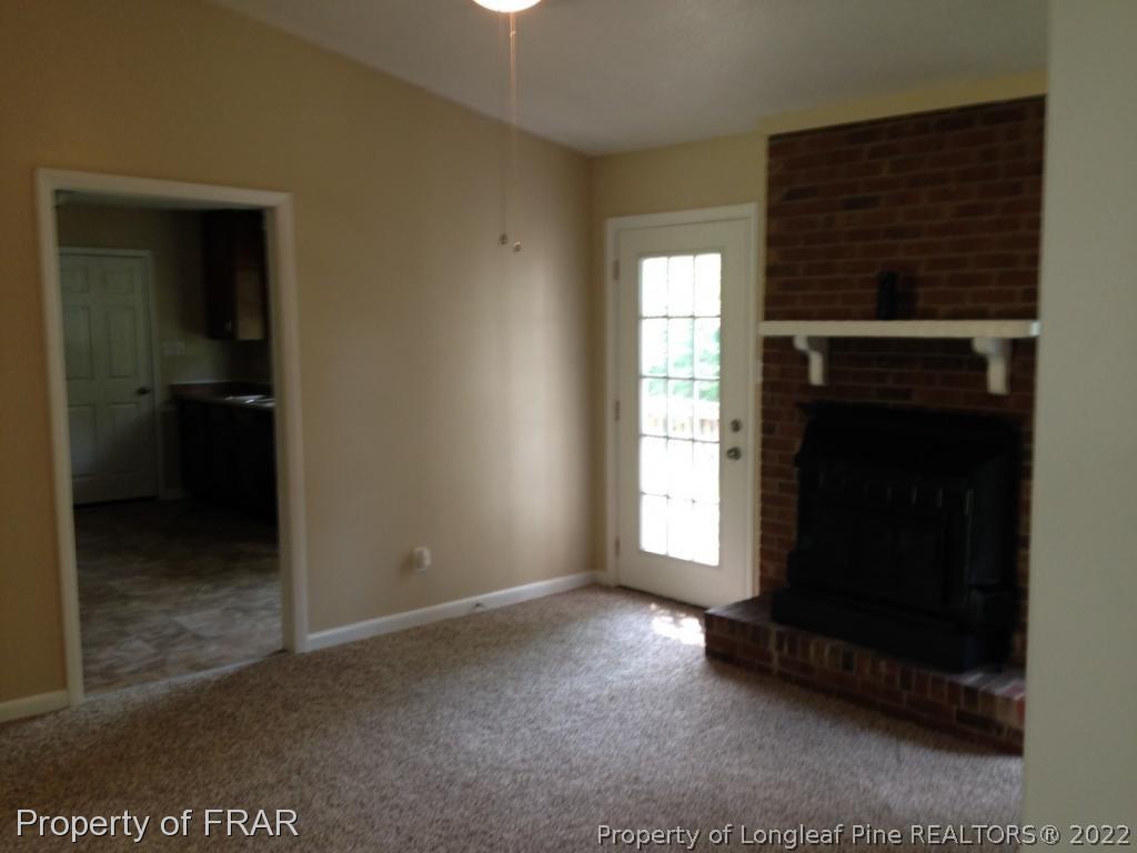 3320 Red Fox Road Spring Lake, NC 28390 - Photo 3 of 19 a view of an empty room with a window