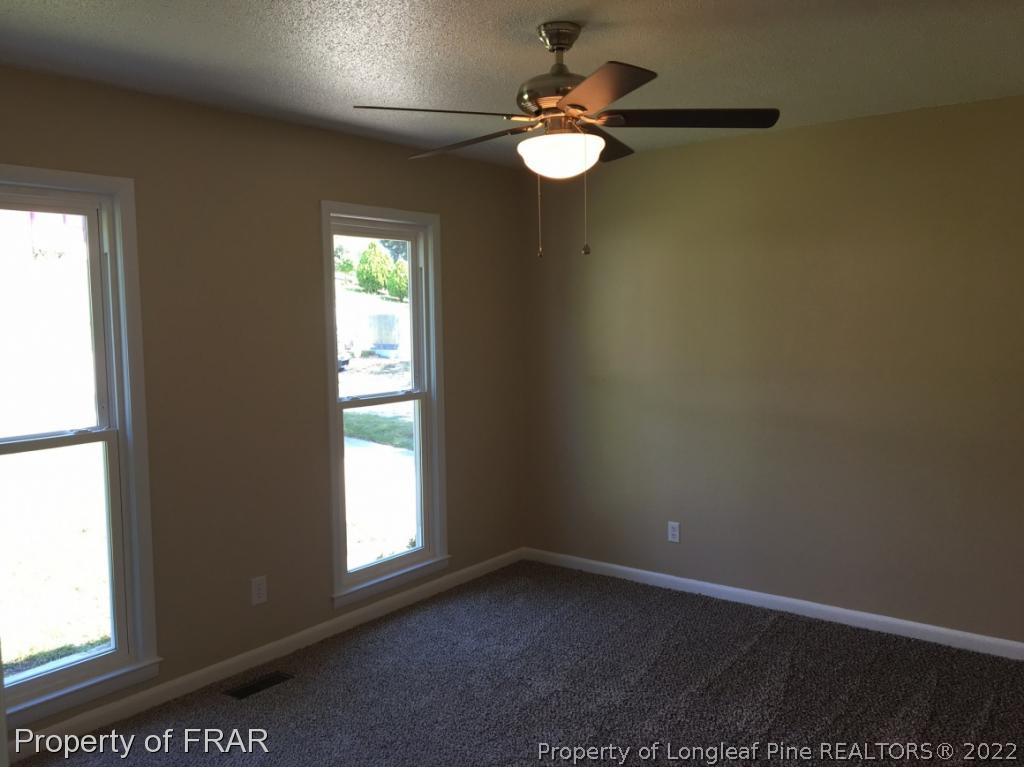 3320 Red Fox Road Spring Lake, NC 28390 - Photo 9 of 19 an empty room with a window