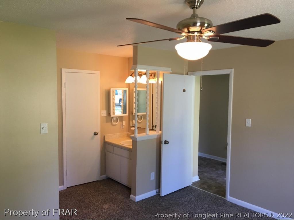3320 Red Fox Road Spring Lake, NC 28390 - Photo 10 of 19 a view of a hallway with chandelier and entryway