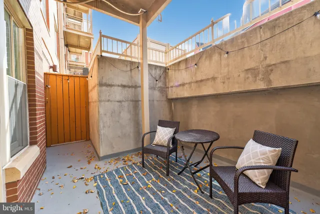 a view of a chair and table in the patio