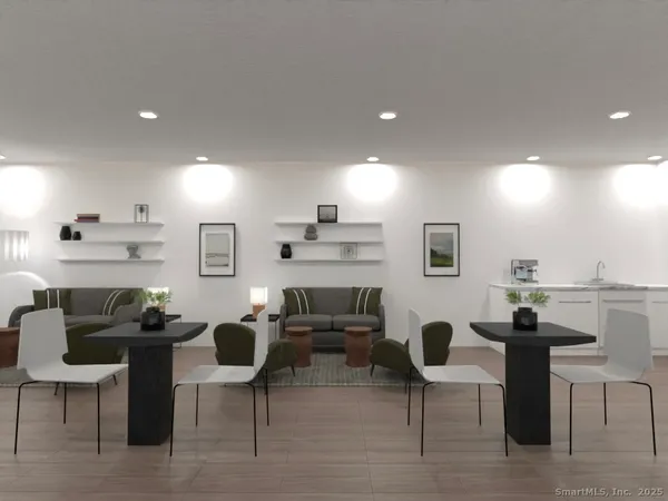 a living room with furniture a rug and a fireplace