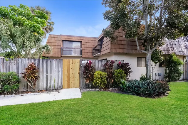 a front view of a house having yard