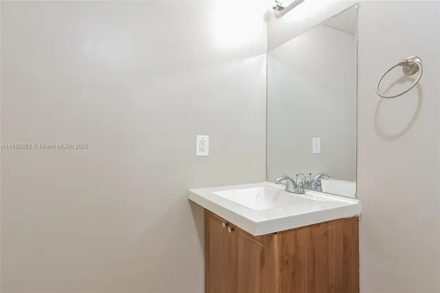 a view of a house with a wooden fence