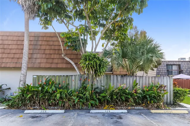 a picture of a bench in front of a wall