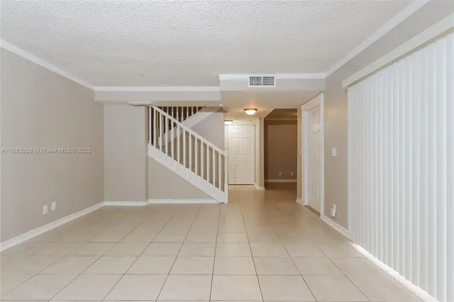 a view of interior and hallway with a large window