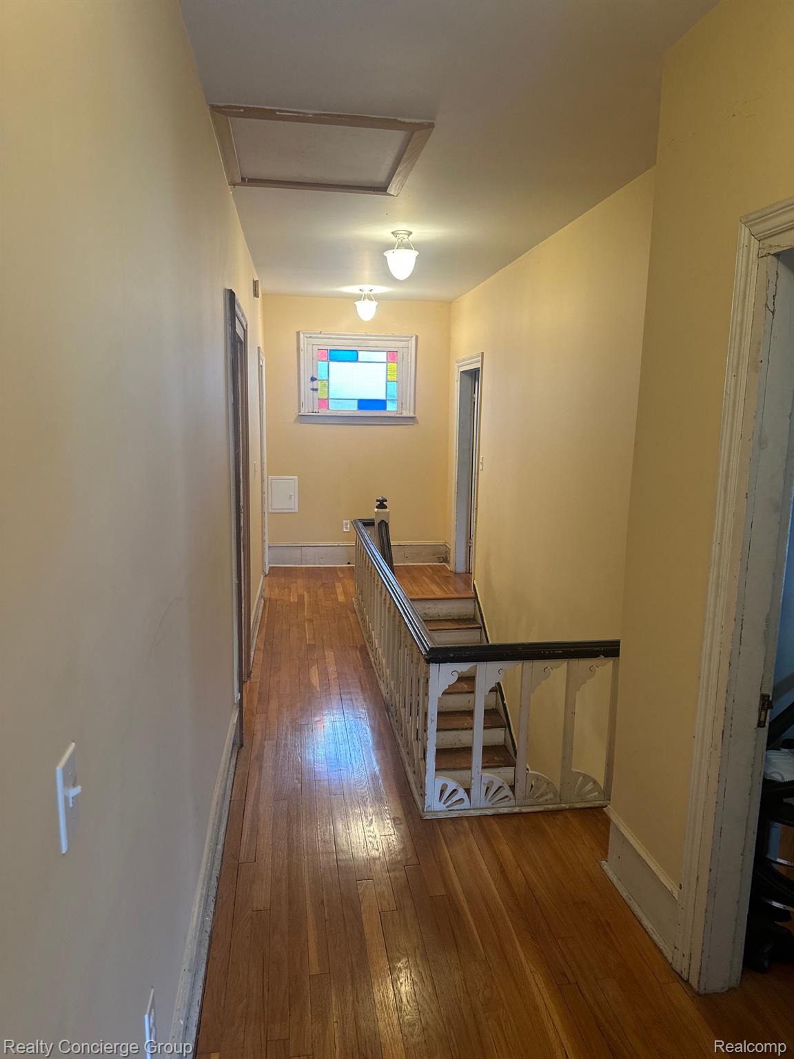 222 Summit Howell, MI 48843 - Photo 34 of 41 Hallway is adorned w/ hardwood floors