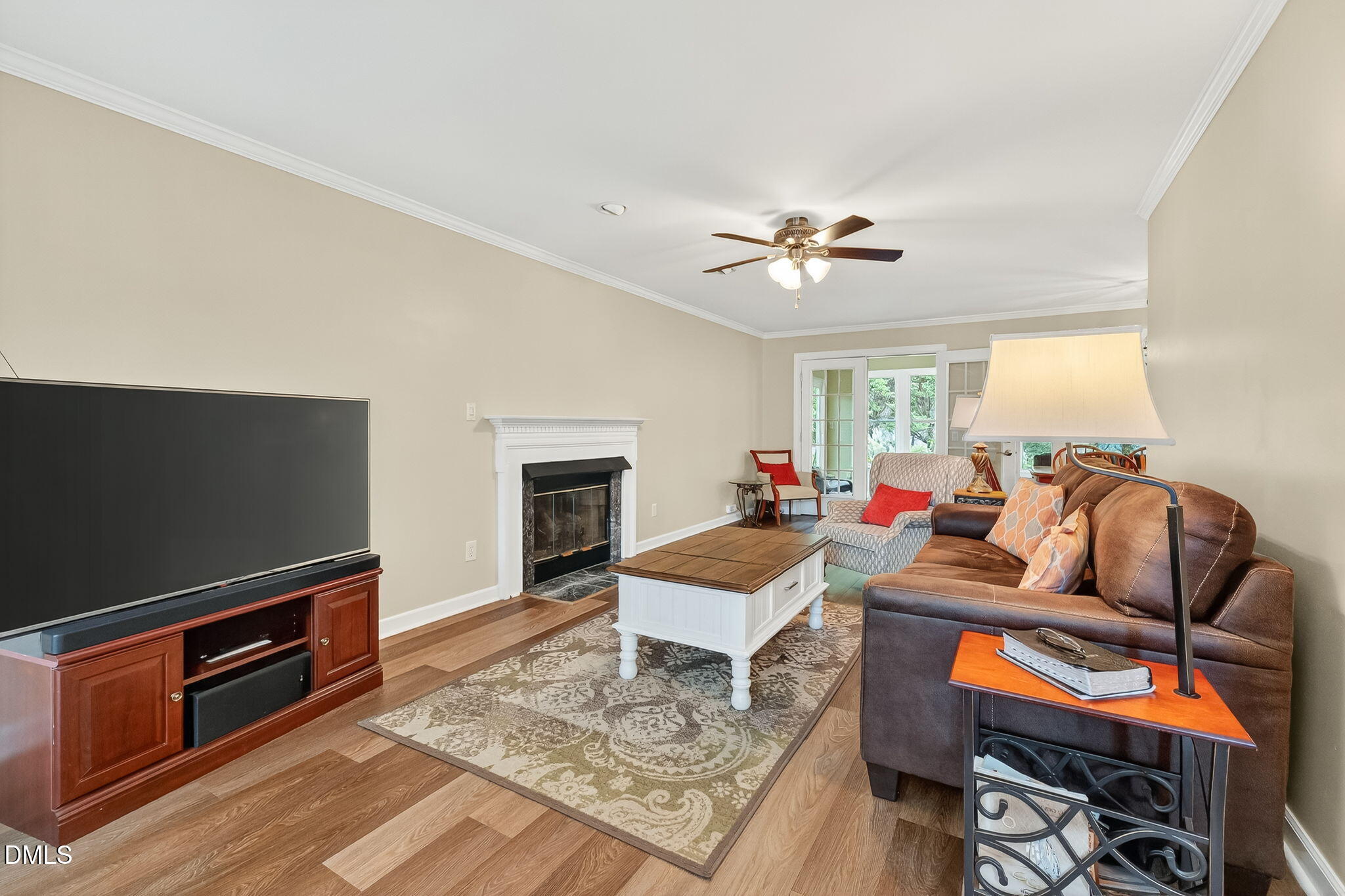 6009 Swales Way Raleigh, NC 27603 - Photo 11 of 59 a living room with furniture a fireplace and a flat screen tv