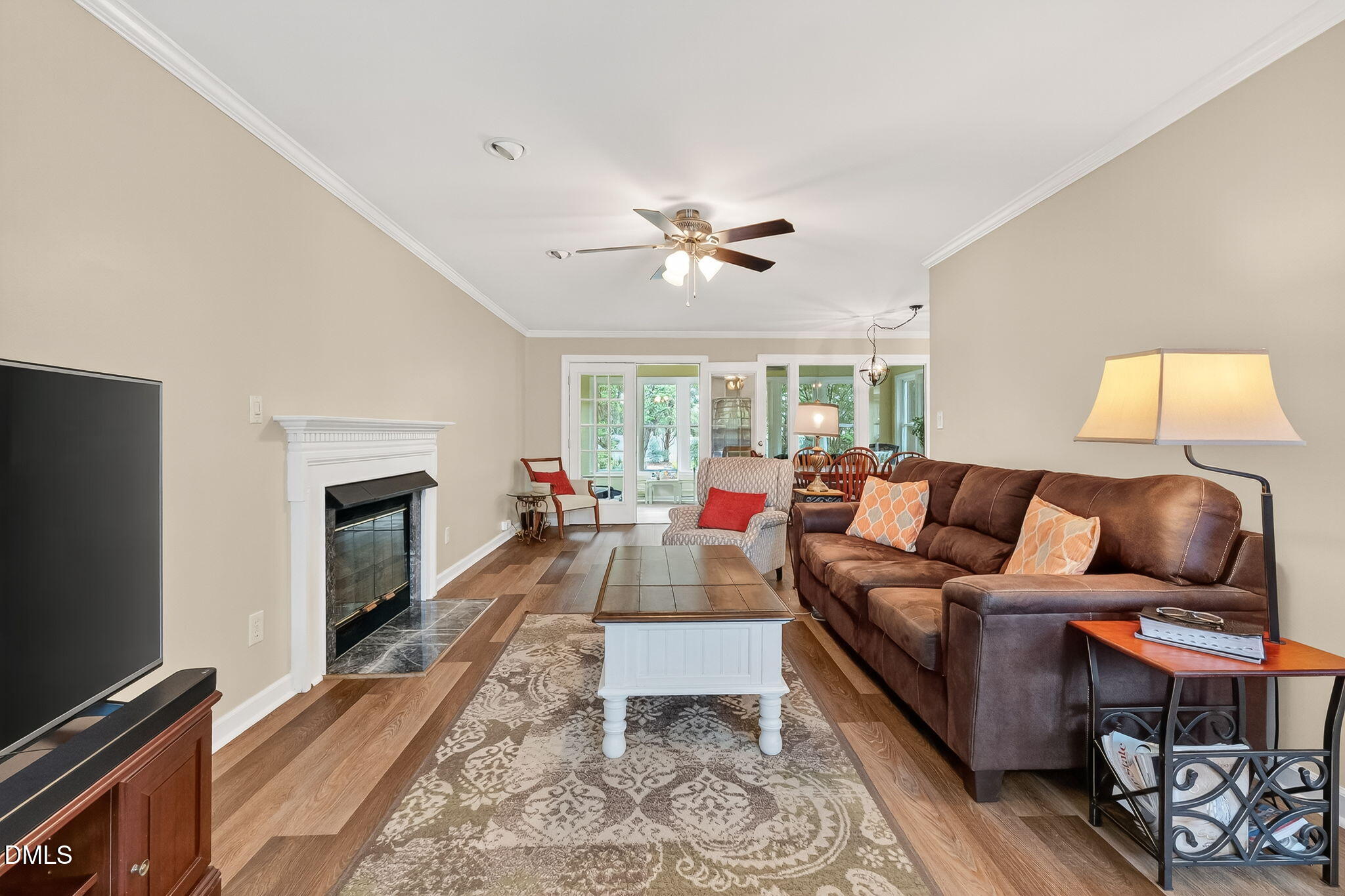 6009 Swales Way Raleigh, NC 27603 - Photo 12 of 59 a living room with furniture fireplace and a flat screen tv