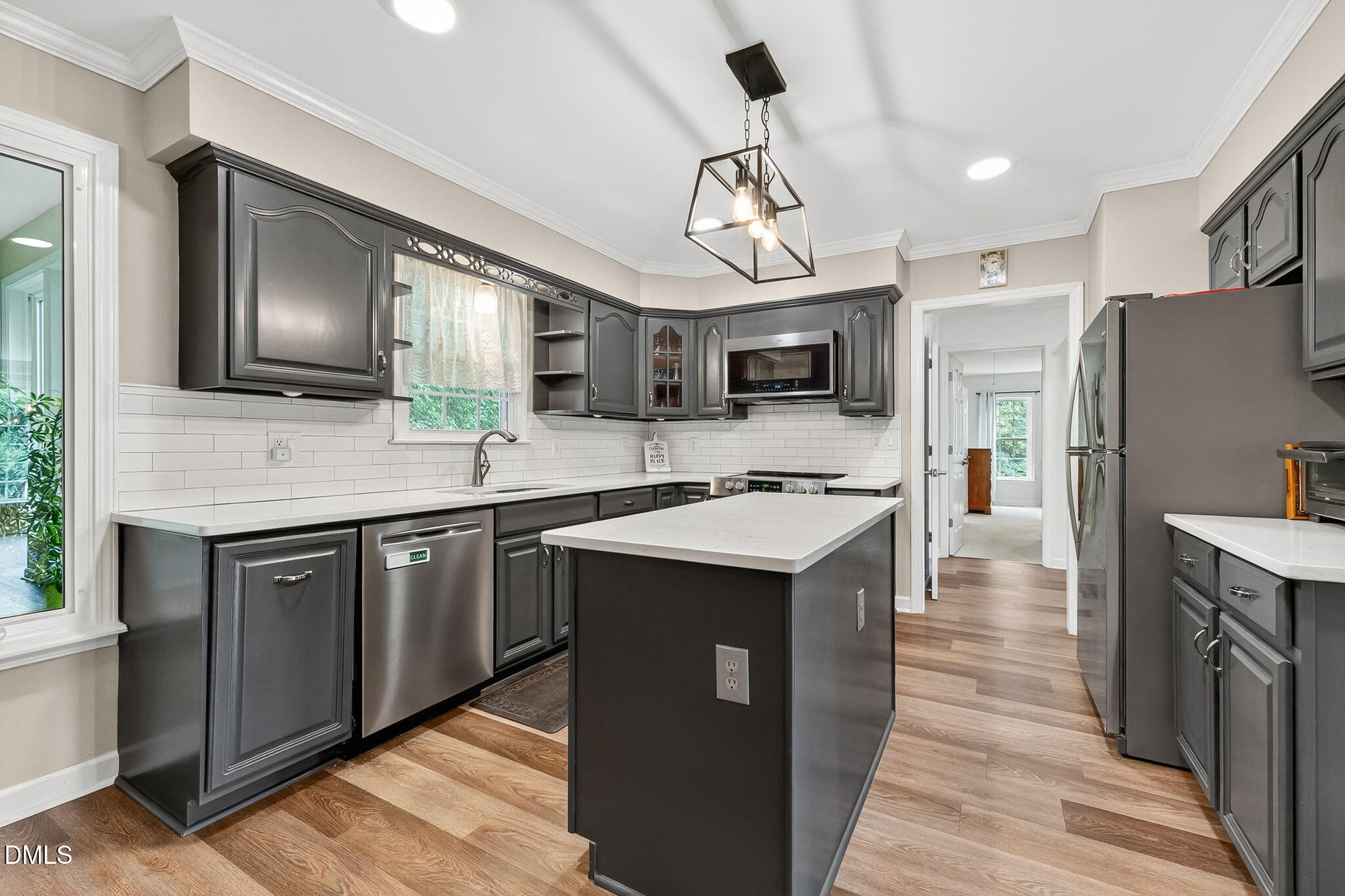6009 Swales Way Raleigh, NC 27603 - Photo 17 of 59 a kitchen with stainless steel appliances granite countertop a sink stove and refrigerator