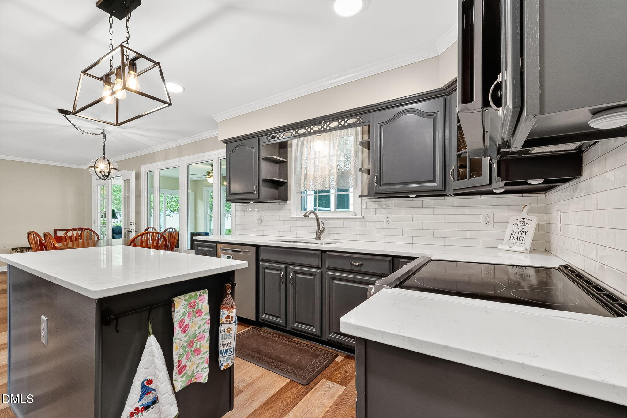6009 Swales Way Raleigh, NC 27603 - Photo 21 of 59 a kitchen with a sink a counter space appliances and cabinets
