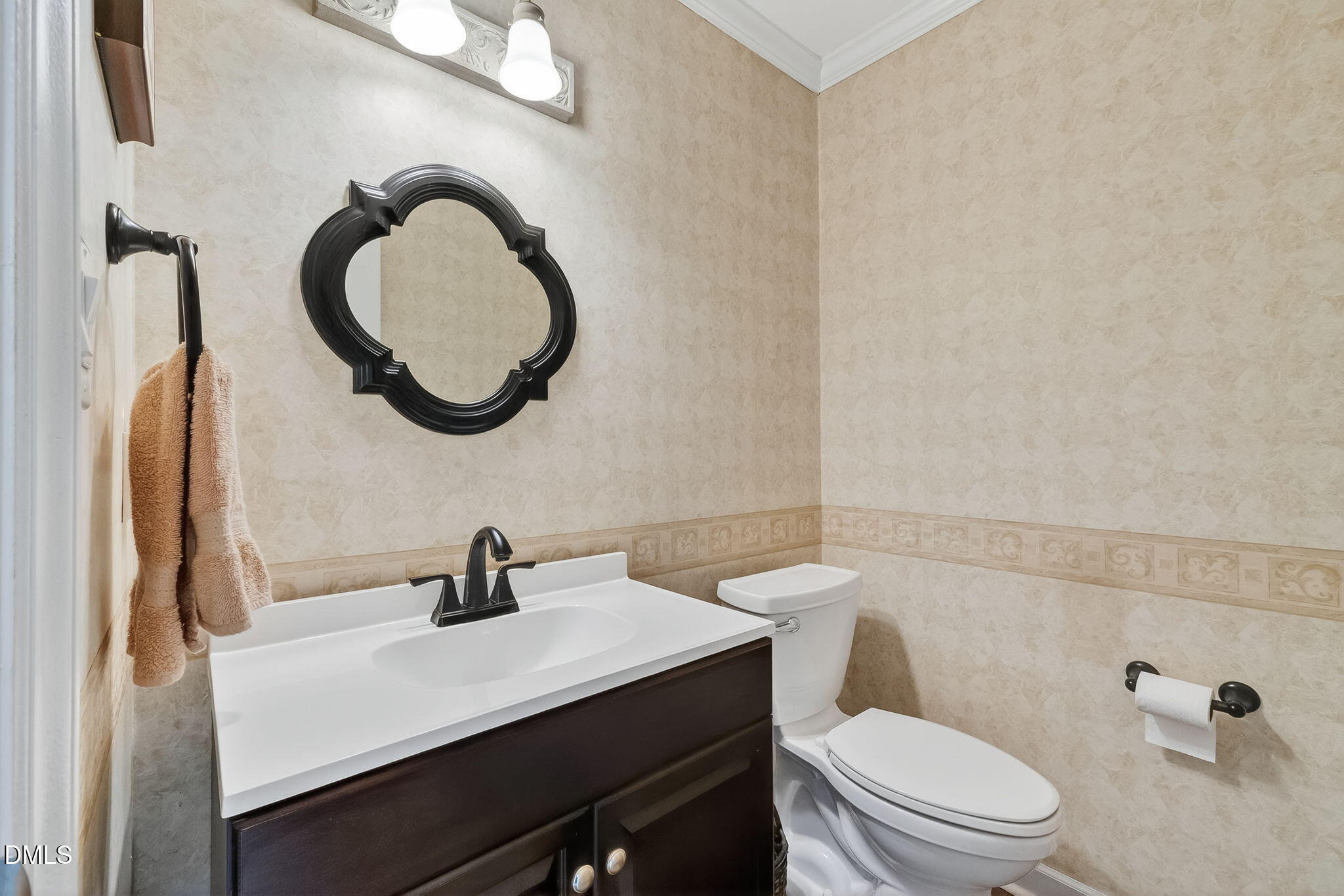 6009 Swales Way Raleigh, NC 27603 - Photo 23 of 59 a bathroom with a sink a toilet and a mirror