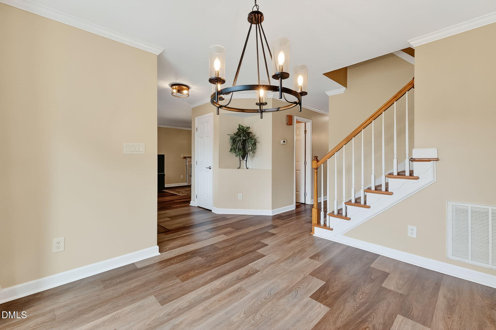 6009 Swales Way Raleigh, NC 27603 - Photo 25 of 59 a view of entryway and hall with wooden floor