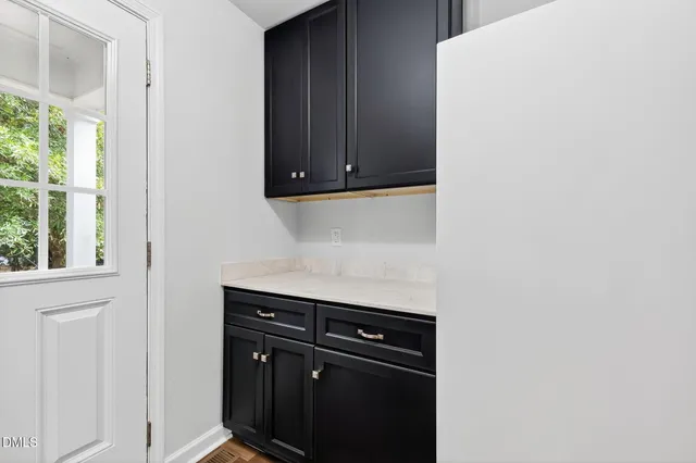 a bathroom with a tub a sink and a large mirror