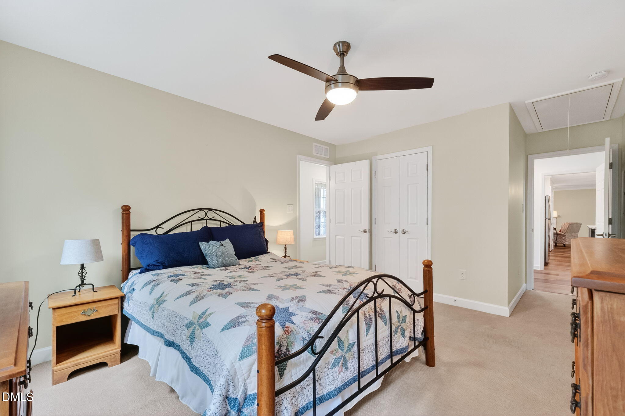 6009 Swales Way Raleigh, NC 27603 - Photo 30 of 59 a bedroom with a bed and a chandelier