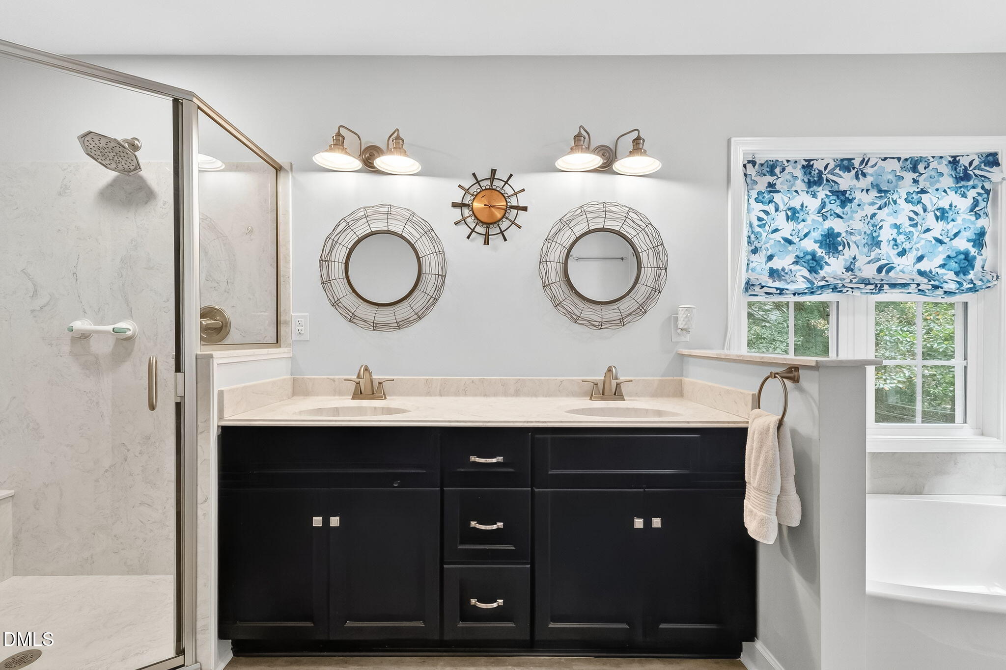 6009 Swales Way Raleigh, NC 27603 - Photo 31 of 59 a bathroom with a double vanity sink and a mirror