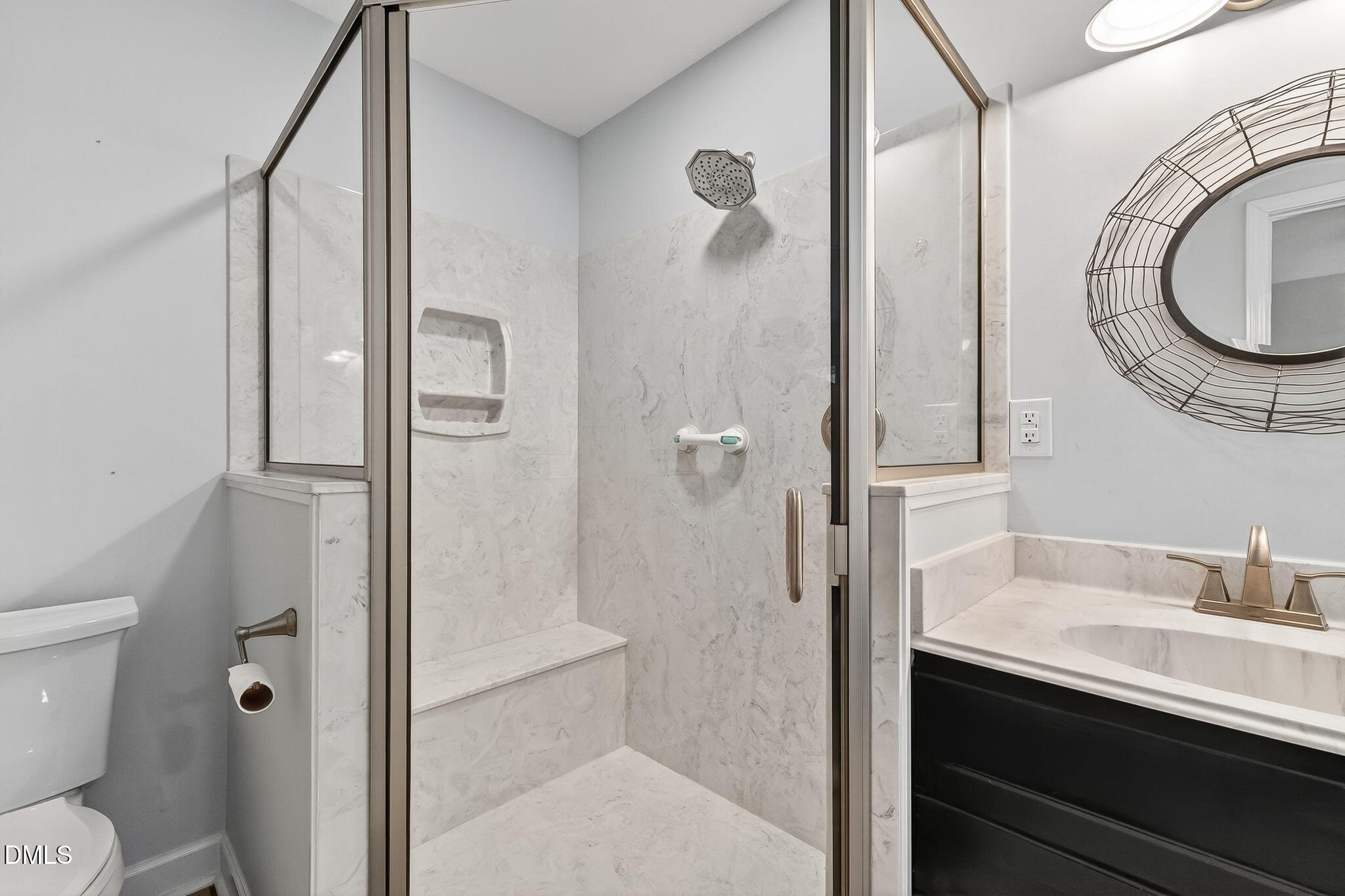 6009 Swales Way Raleigh, NC 27603 - Photo 33 of 59 a bathroom with a sink a toilet and a mirror
