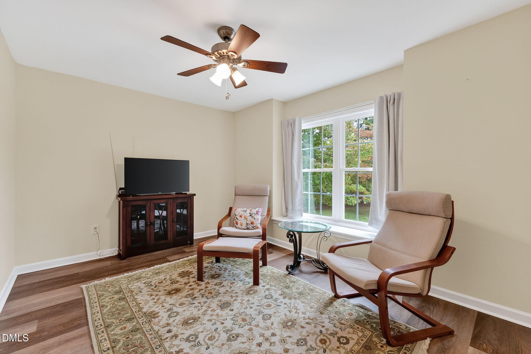 6009 Swales Way Raleigh, NC 27603 - Photo 35 of 59 a living room with furniture and a flat screen tv