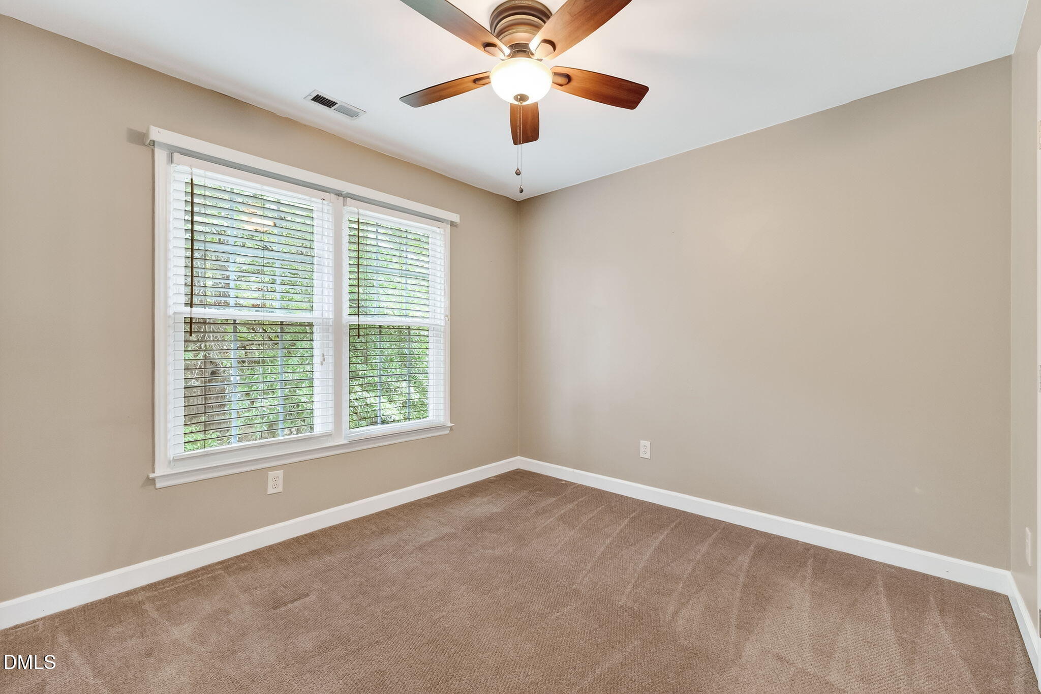 6009 Swales Way Raleigh, NC 27603 - Photo 37 of 59 a view of a room with windows and ceiling fan