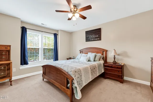 a spacious bathroom with a tub and a view of bathroom