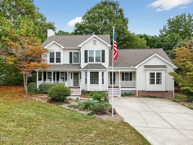 a aerial view of a house with a yard
