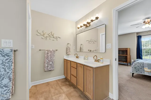 a view of a house with backyard and trees