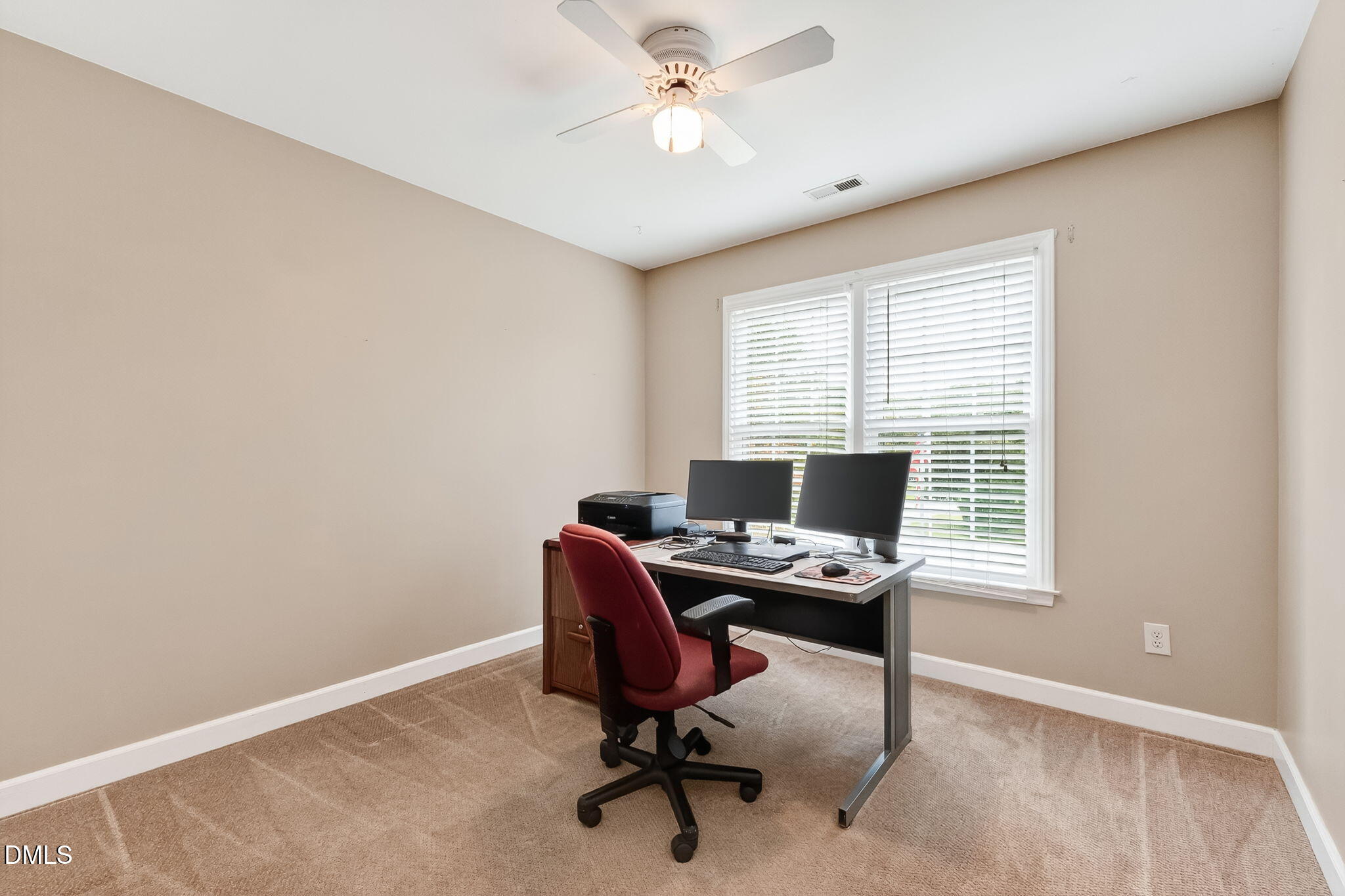 6009 Swales Way Raleigh, NC 27603 - Photo 47 of 59 a view of a workspace with furniture and a window