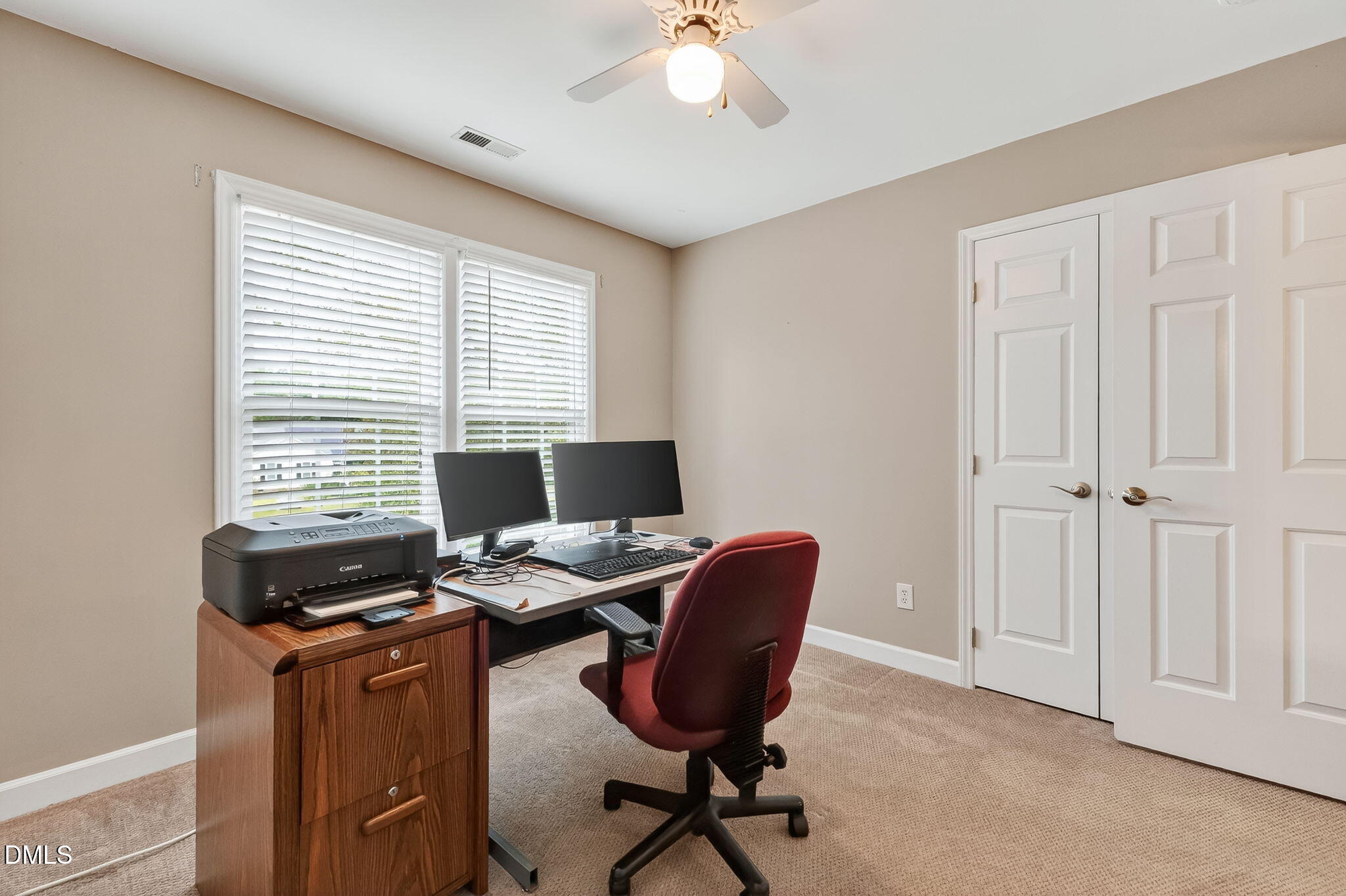 6009 Swales Way Raleigh, NC 27603 - Photo 48 of 59 a view of a workspace with furniture and a window