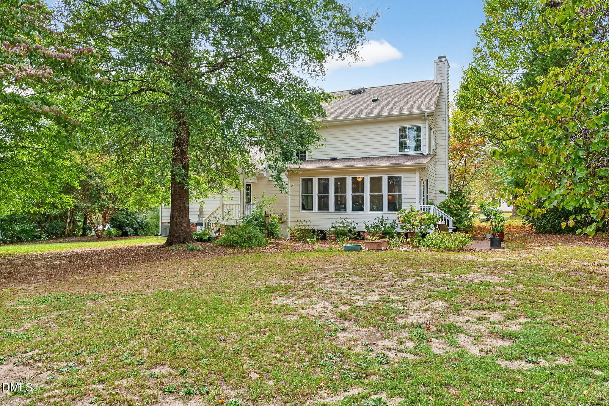 6009 Swales Way Raleigh, NC 27603 - Photo 52 of 59 a view of a house with backyard and trees
