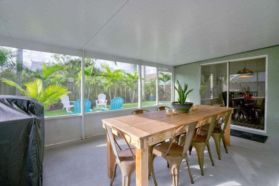 6178 Garrett Street Jupiter, FL 33458 - Photo 17 of 18 a view of a dining room with furniture window and outside view