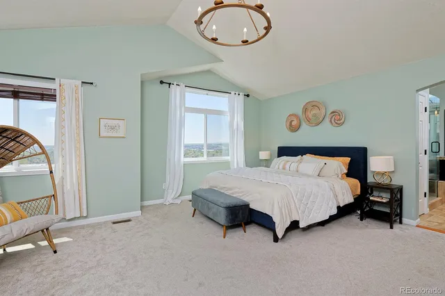 a bedroom with a bed flowerpot and window